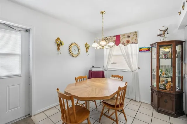 a view of a dining room with furniture and window