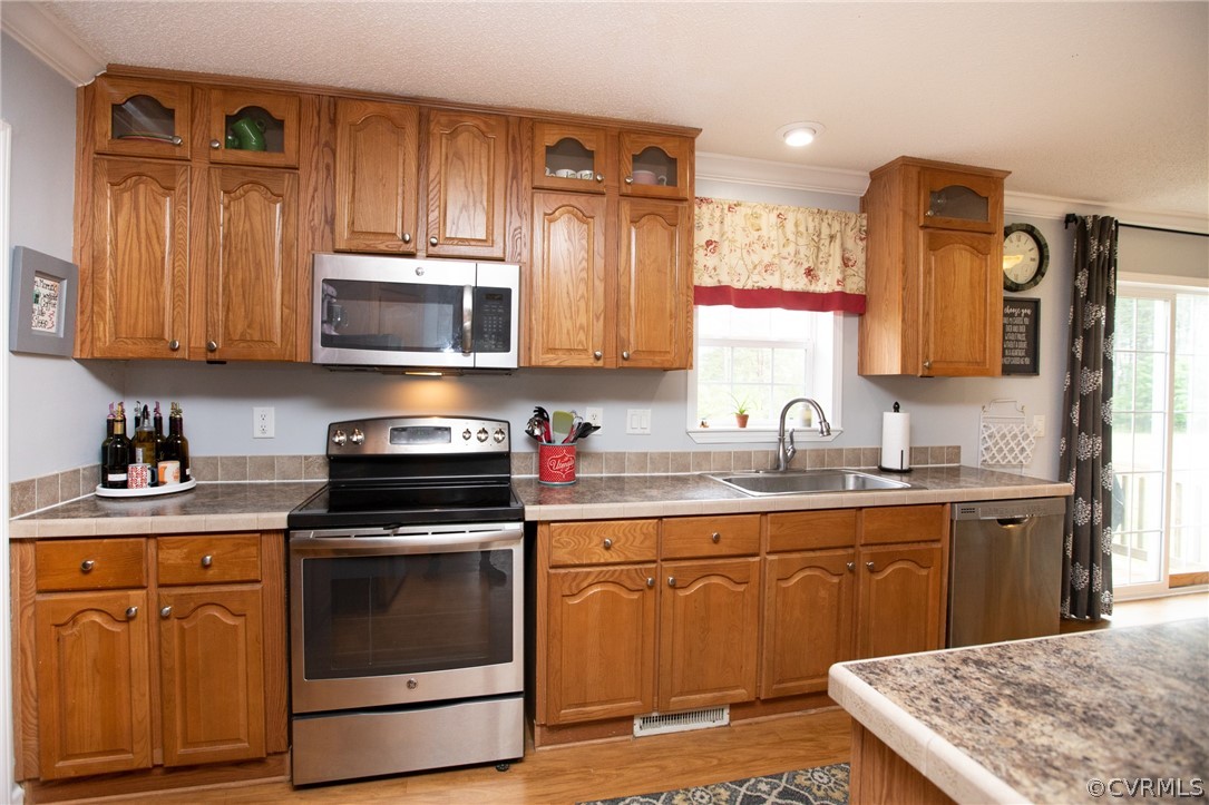 2862 Stage Coach Road Farmville, VA 23901 - Photo 15 of 48 a kitchen with stainless steel appliances granite countertop a stove a sink and a microwave