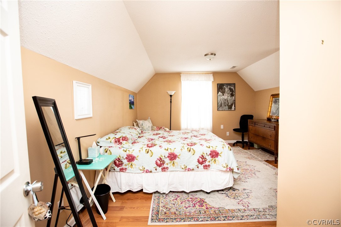 2862 Stage Coach Road Farmville, VA 23901 - Photo 36 of 48 a room with a bed and a flat screen tv
