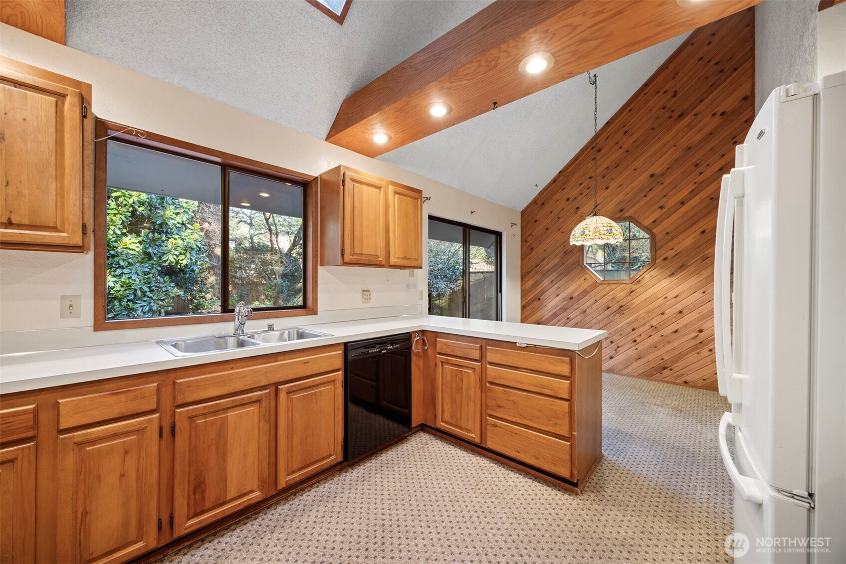 413 Viewcrest Road Bellingham, WA 98229 - Photo 11 of 40 a kitchen with wooden cabinets and sink