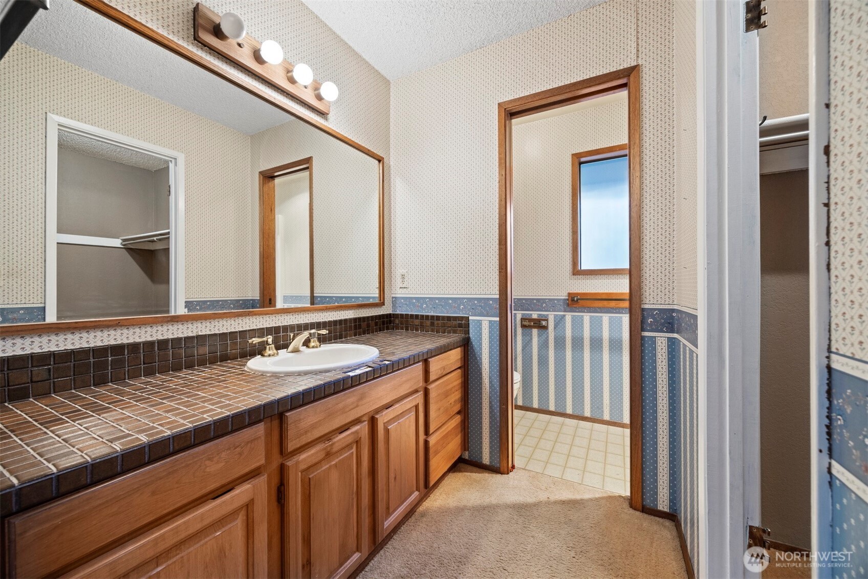 413 Viewcrest Road Bellingham, WA 98229 - Photo 16 of 40 a bathroom with a sink and a mirror