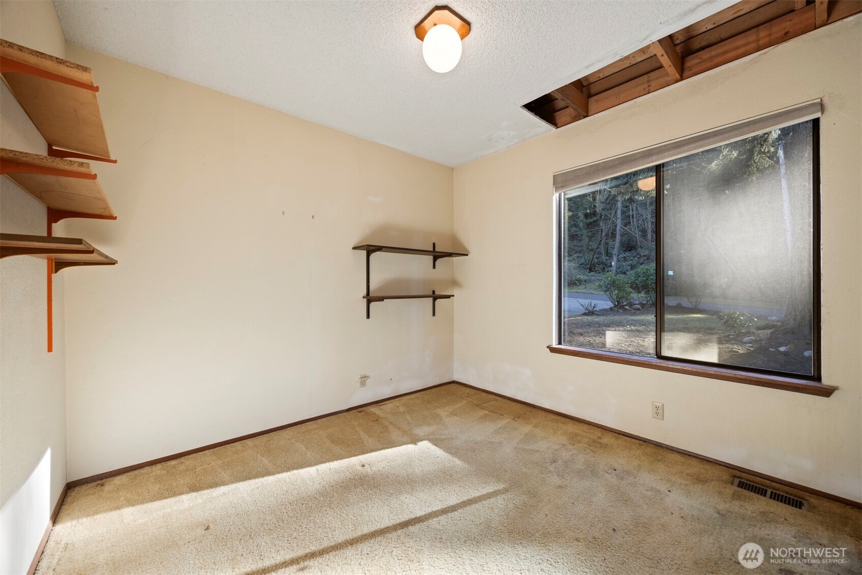 413 Viewcrest Road Bellingham, WA 98229 - Photo 19 of 40 a view of a room with wooden floor and windows