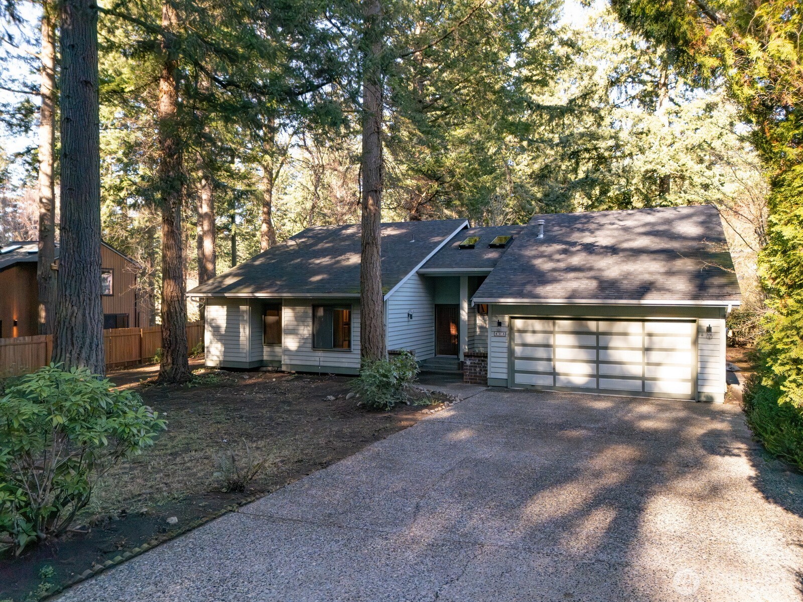 413 Viewcrest Road Bellingham, WA 98229 - Photo 2 of 40 a front view of a house with a yard and garage