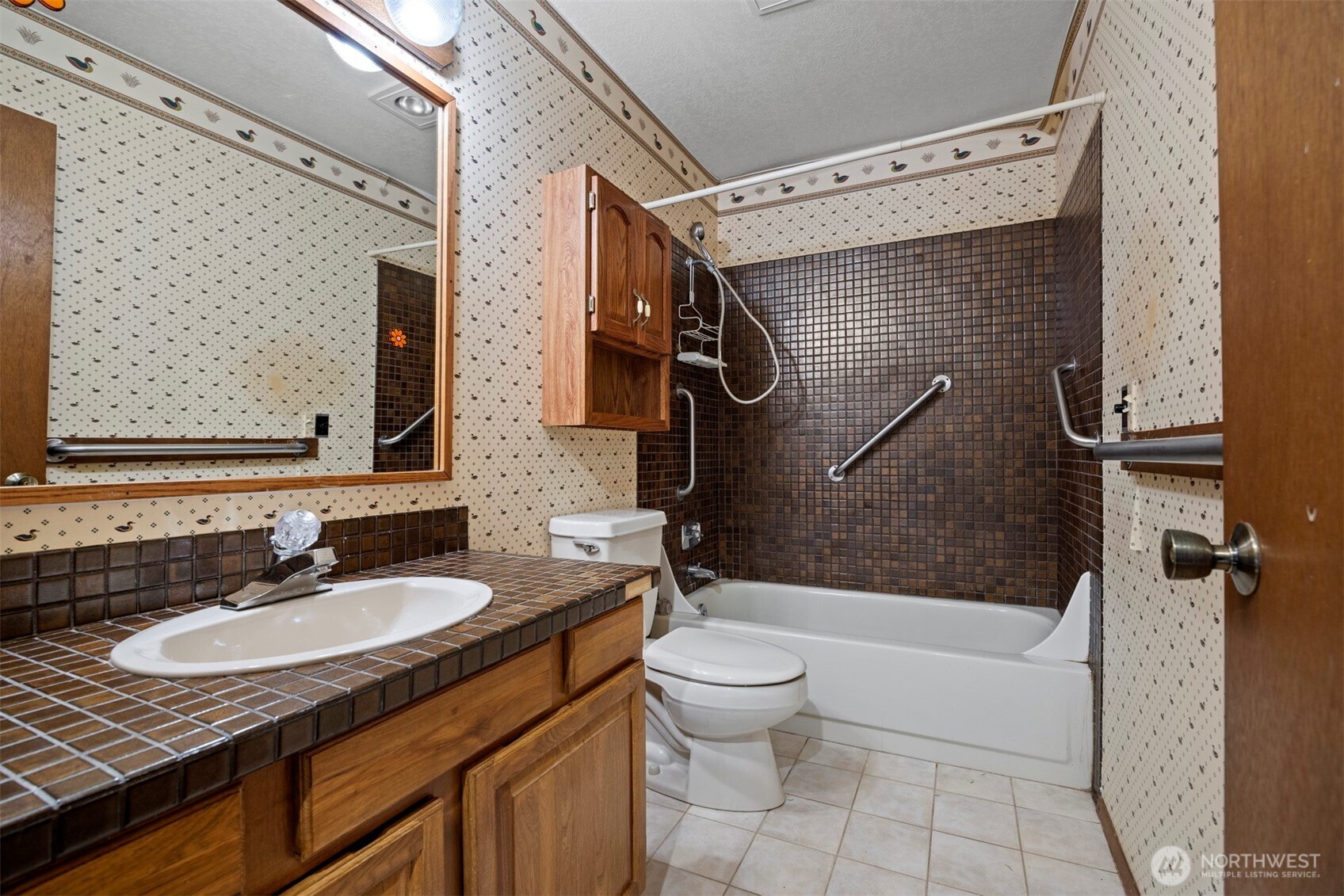 413 Viewcrest Road Bellingham, WA 98229 - Photo 21 of 40 a bathroom with a granite countertop sink toilet and shower