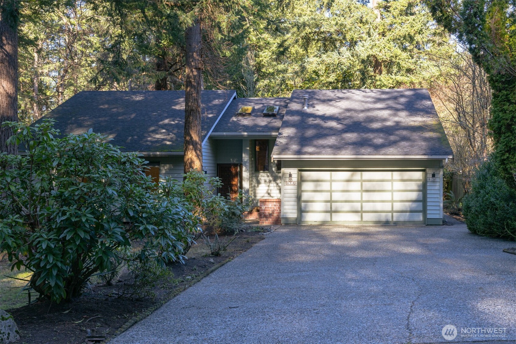 413 Viewcrest Road Bellingham, WA 98229 - Photo 40 of 40 a view of a house with a yard and garage