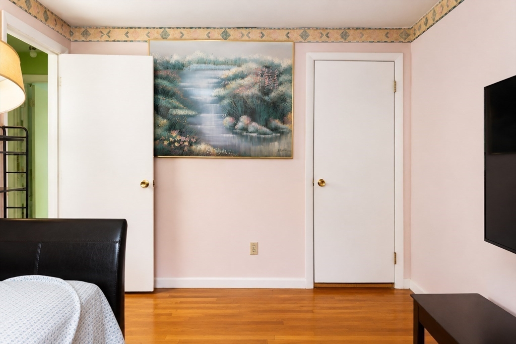 18 Ralston Road Boston, MA 02136 - Photo 12 of 26 a view of a bedroom with wooden floor and small hallway