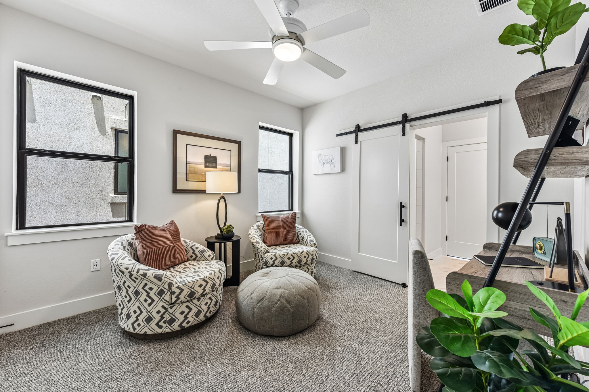 9033 Cattle Baron Path Austin, TX 78747 - Photo 20 of 40 A quiet retreat, this study offers comfort and style with barn doors and recessed lighting.