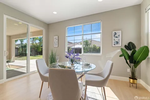 a view of a dining room with furniture window and outside view