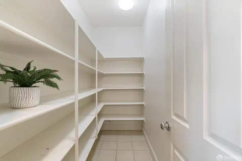 a view of a room that has a potted plant on the wall