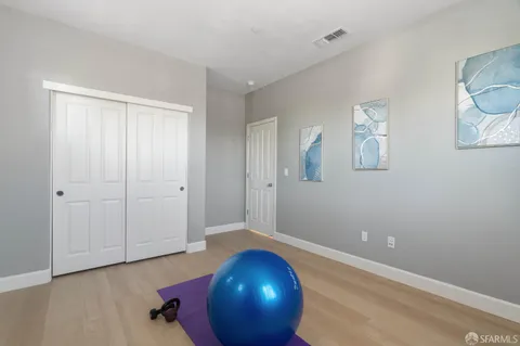 a bathroom with a granite countertop sink a toilet and a mirror
