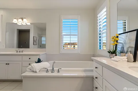 a bathroom with a shower and a glass door