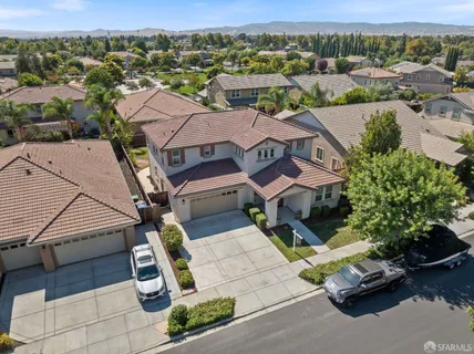 an aerial view of a house with a garden