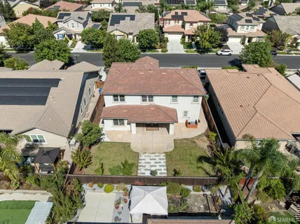 an aerial view of a house with yard