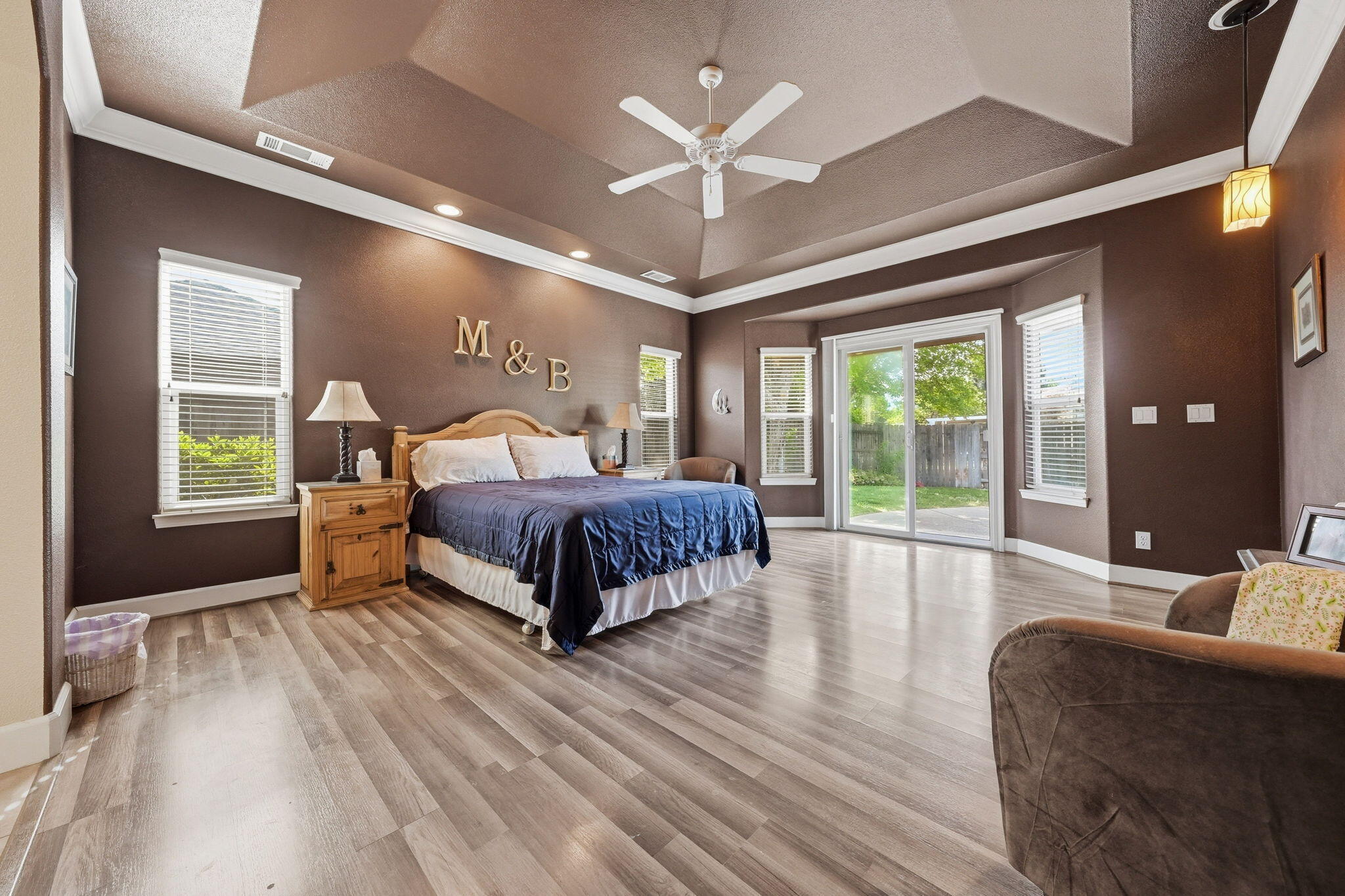 2175 Tradition Way Redding, CA 96001 - Photo 15 of 36 a spacious bedroom with a bed window and a table