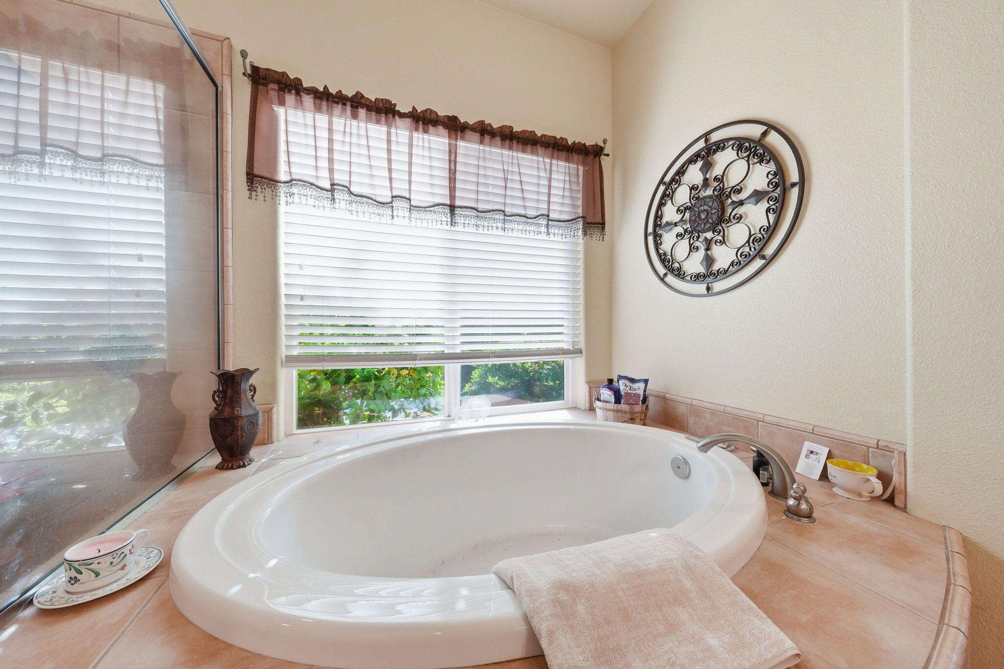 2175 Tradition Way Redding, CA 96001 - Photo 18 of 36 a white bath tub sitting in a bathroom next to a window