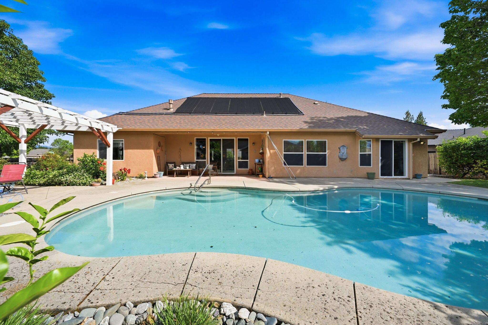 2175 Tradition Way Redding, CA 96001 - Photo 2 of 36 a view of a house with a swimming pool