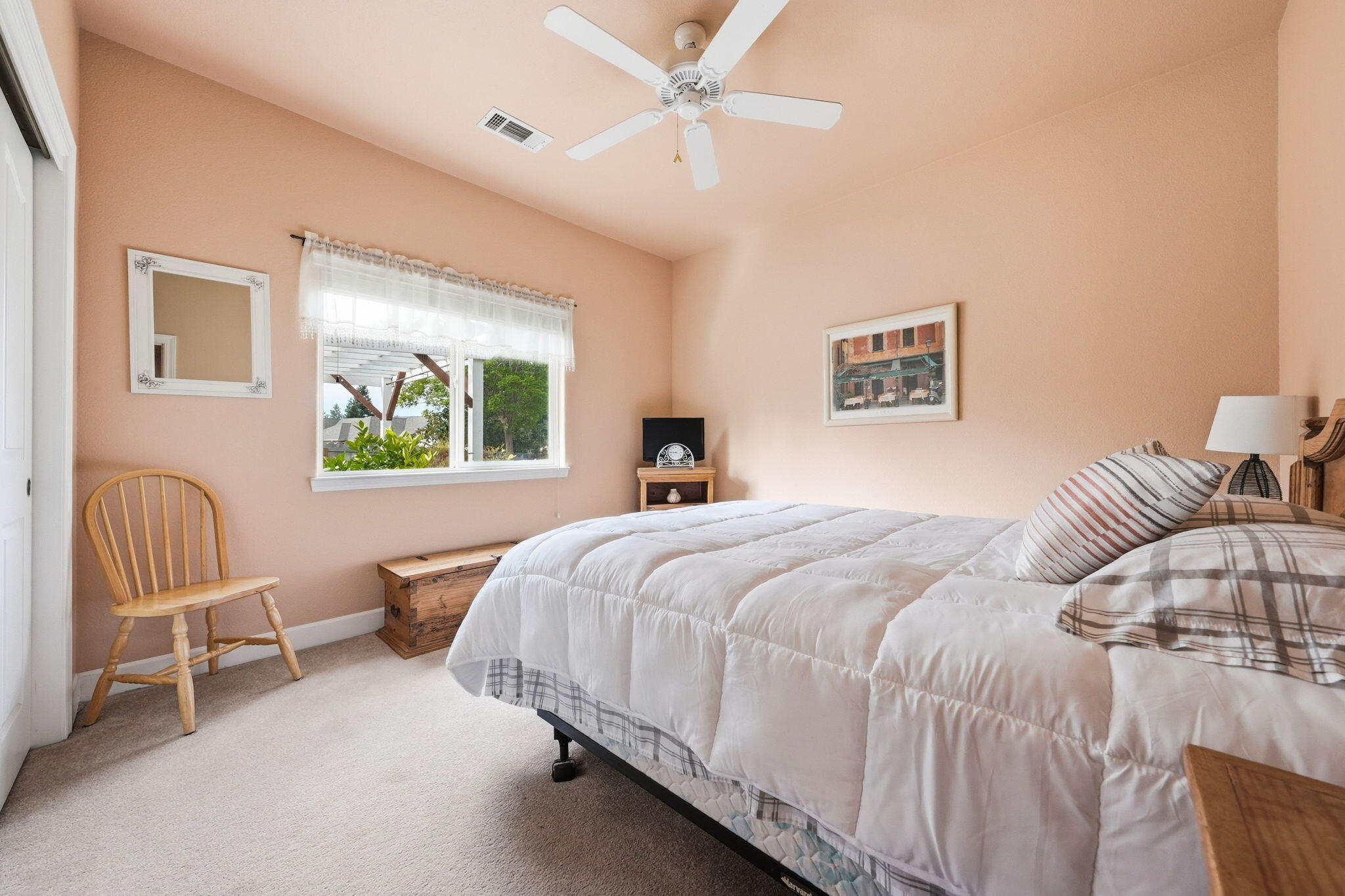 2175 Tradition Way Redding, CA 96001 - Photo 22 of 36 a bedroom with a bed large window and painting on the wall
