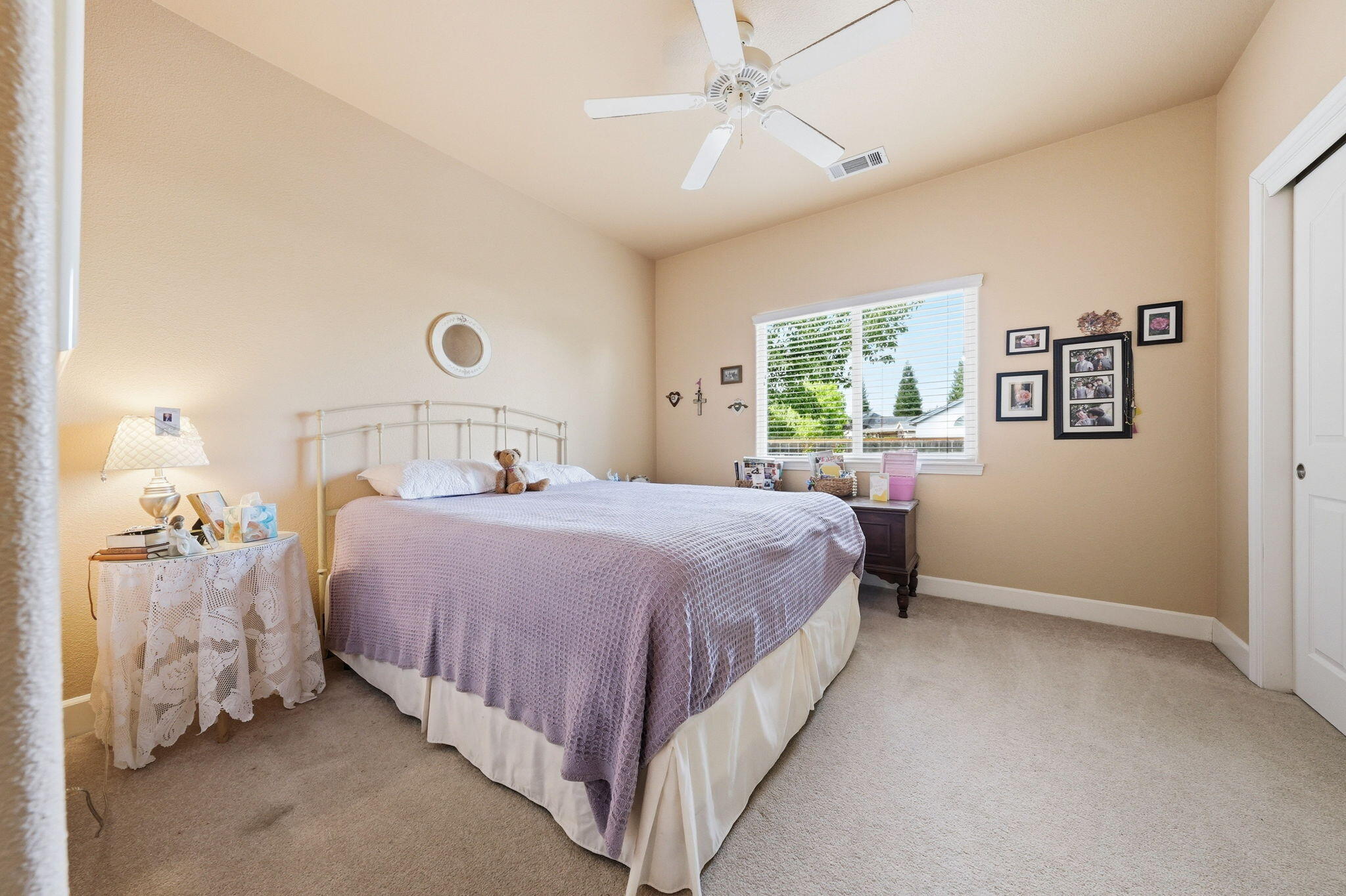 2175 Tradition Way Redding, CA 96001 - Photo 23 of 36 a bedroom with a bed and a chandelier