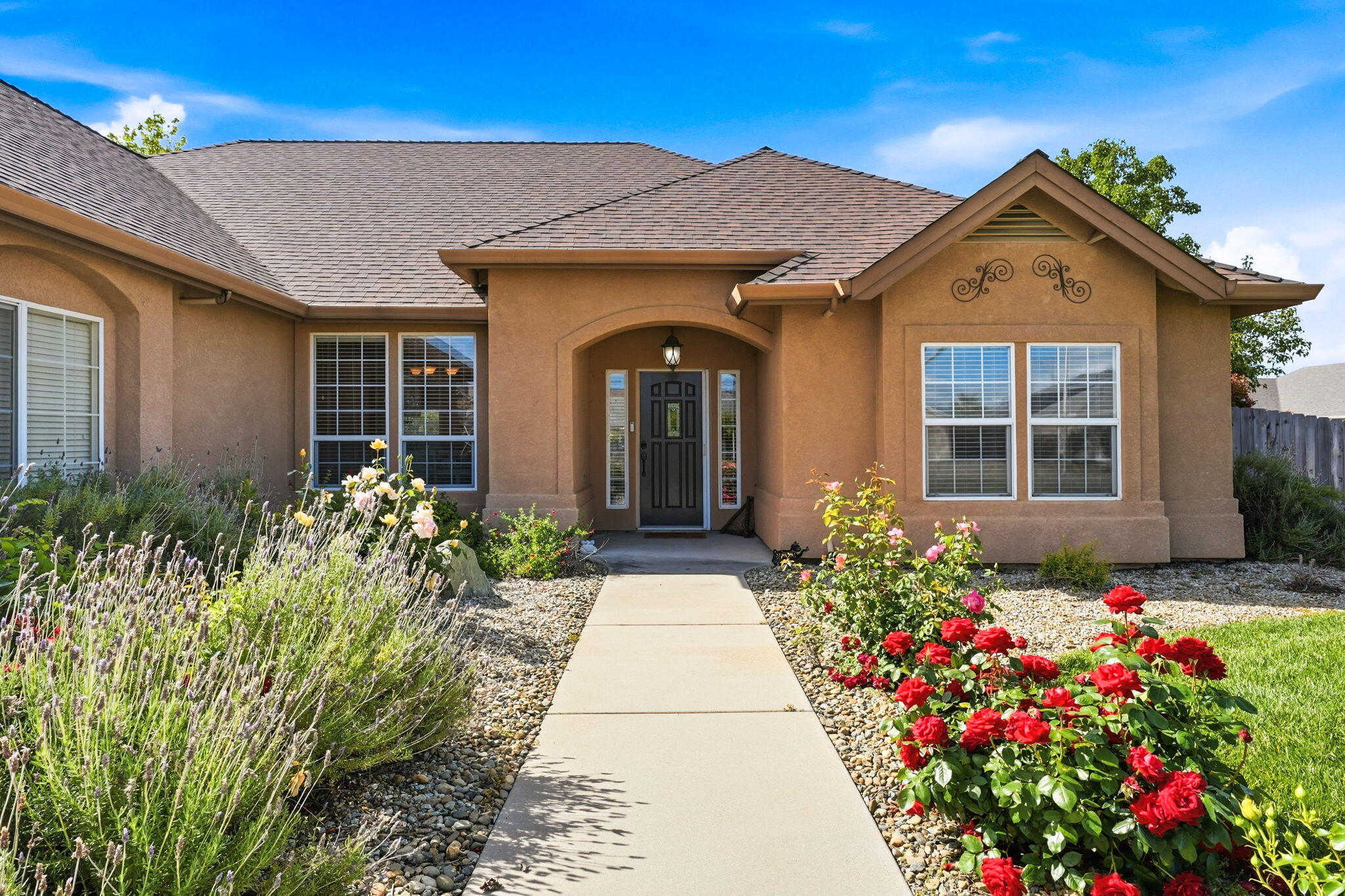 2175 Tradition Way Redding, CA 96001 - Photo 3 of 36 a front view of a house with a yard