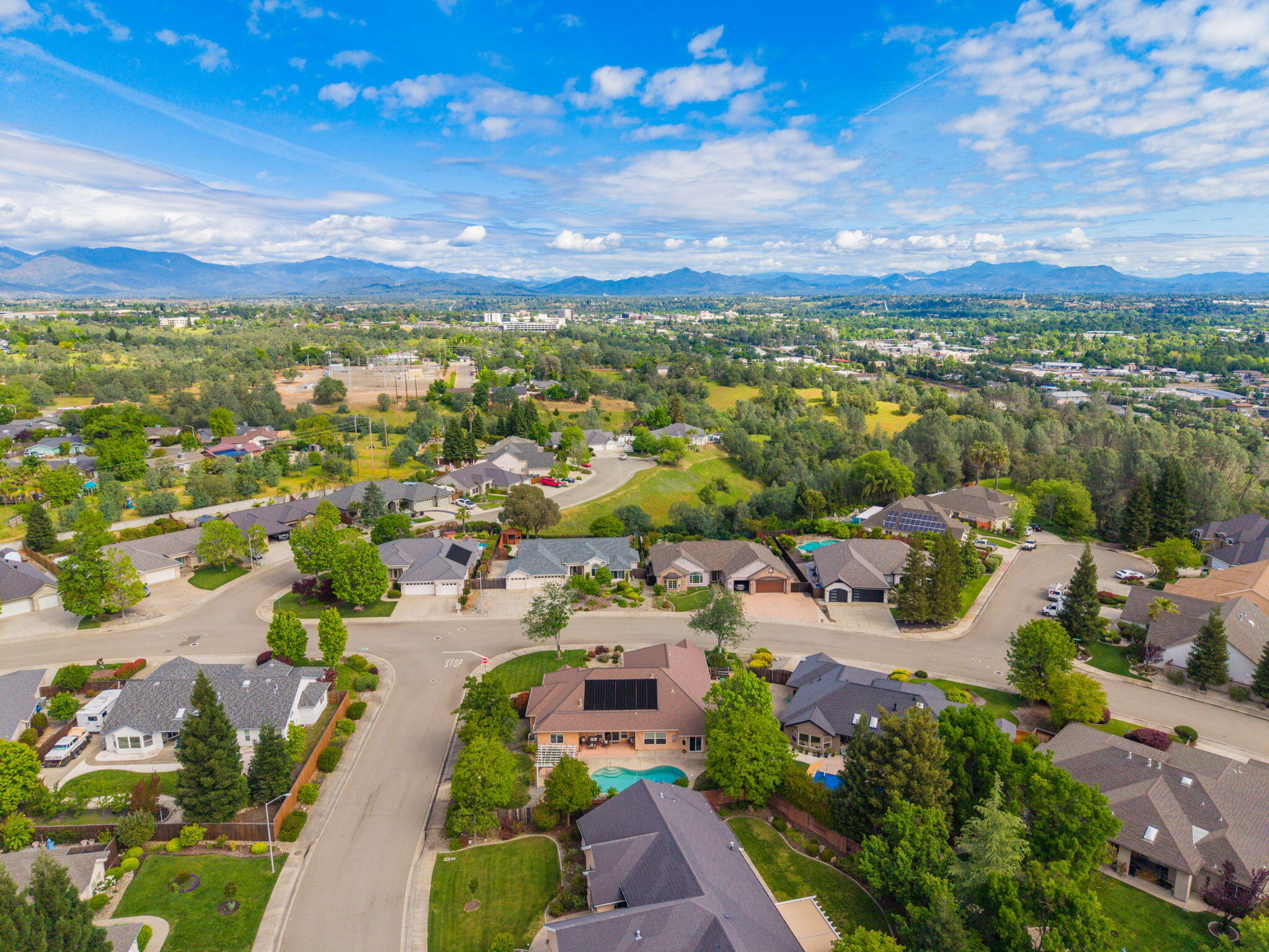 2175 Tradition Way Redding, CA 96001 - Photo 33 of 36 a view of a city with lots of residential buildings ocean and mountain view in back