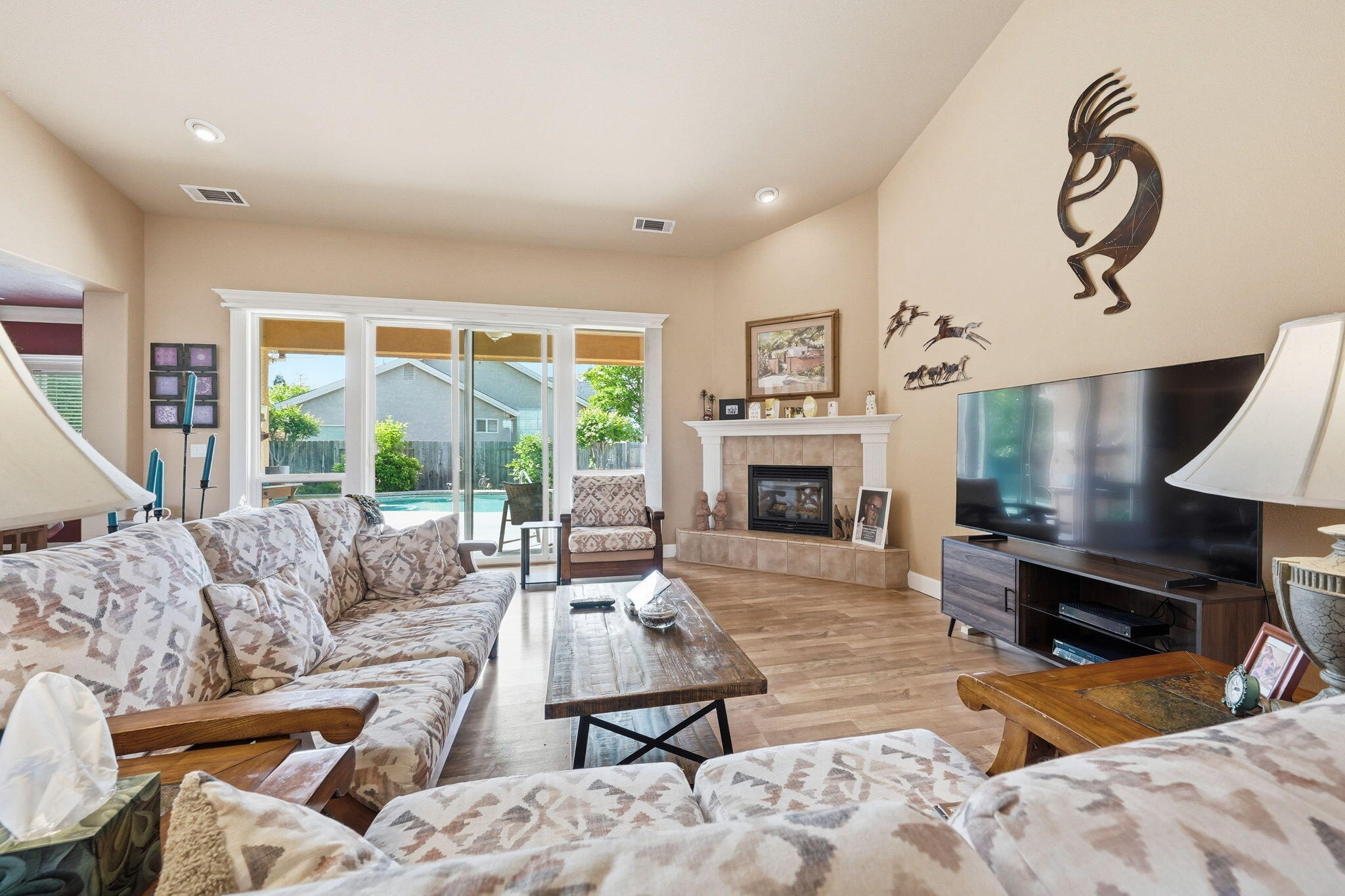 2175 Tradition Way Redding, CA 96001 - Photo 5 of 36 a living room with furniture fireplace and a large window