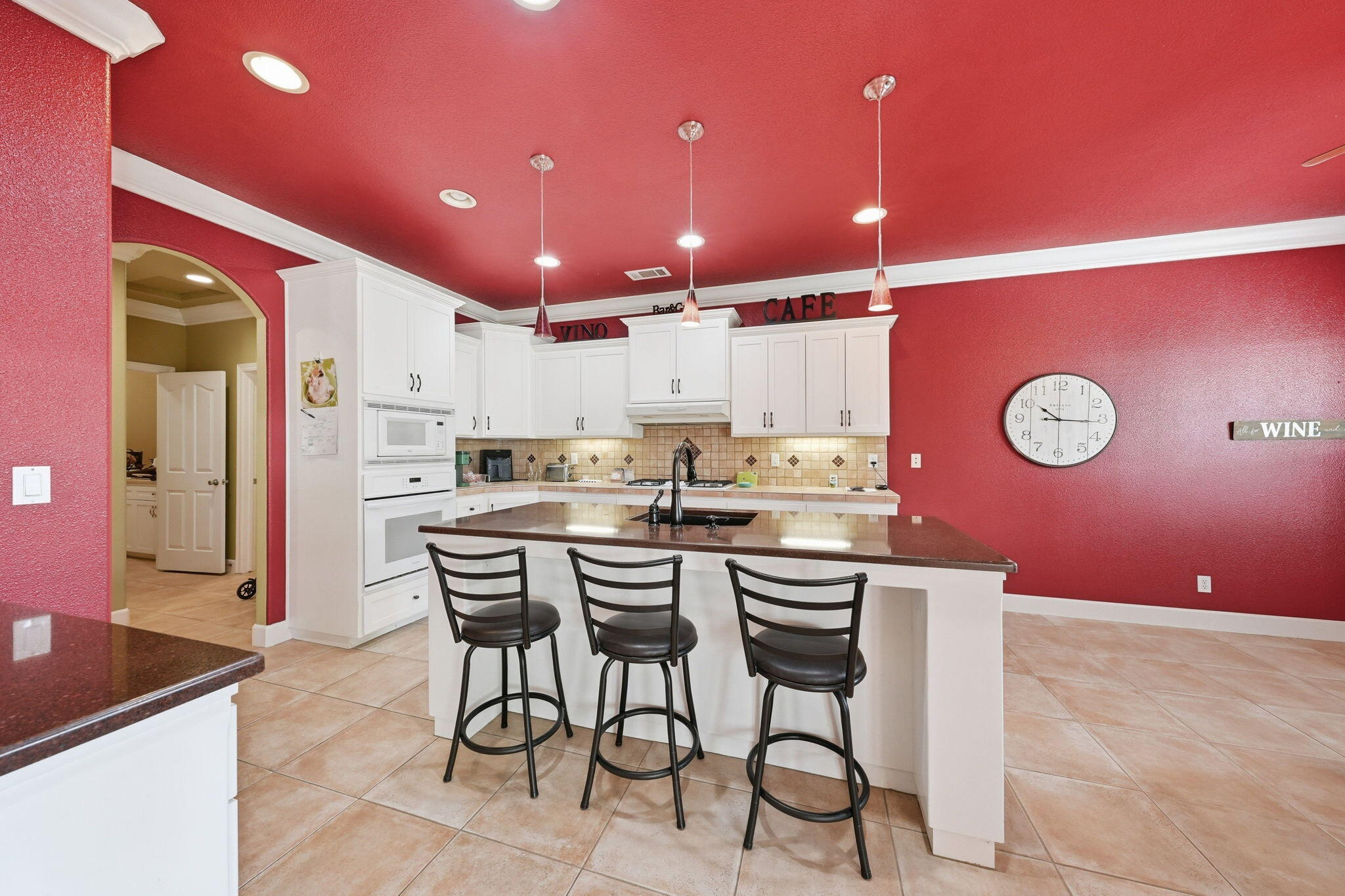 2175 Tradition Way Redding, CA 96001 - Photo 8 of 36 a kitchen with kitchen island stainless steel appliances a sink and cabinets