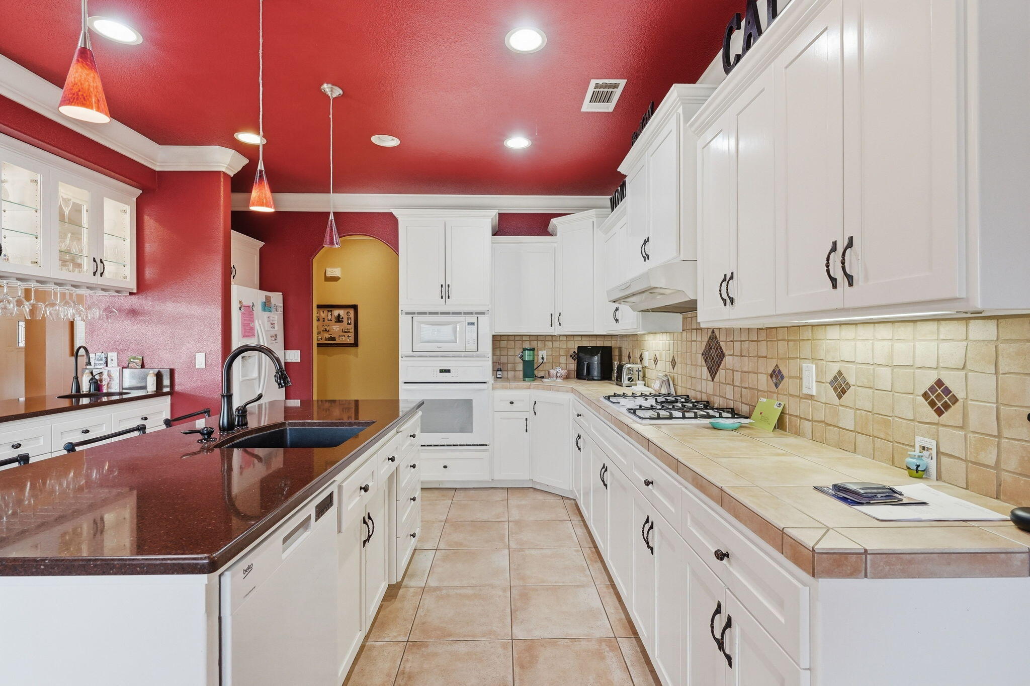 2175 Tradition Way Redding, CA 96001 - Photo 9 of 36 a kitchen with stainless steel appliances granite countertop a sink stove and cabinets