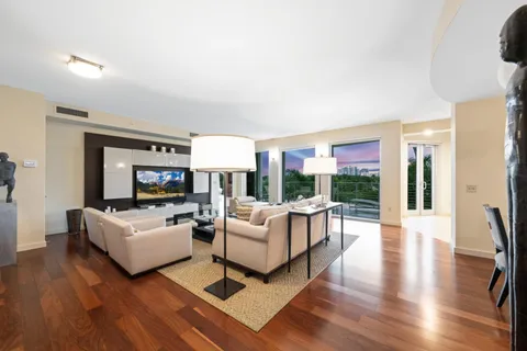 a kitchen with stainless steel appliances granite countertop a sink a stove and a refrigerator