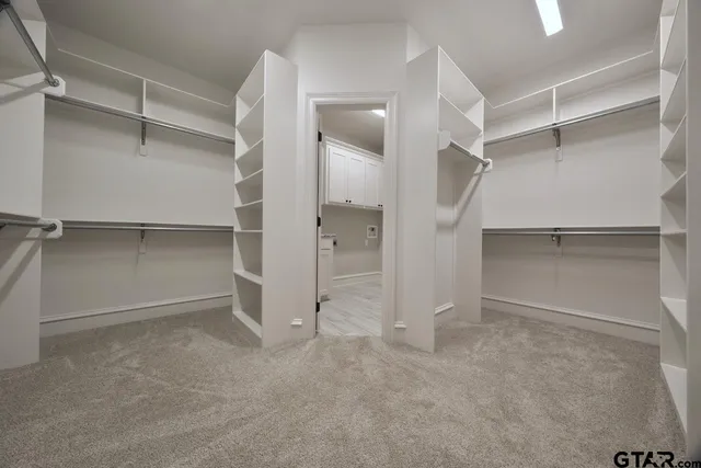 a view of an empty walk in closet