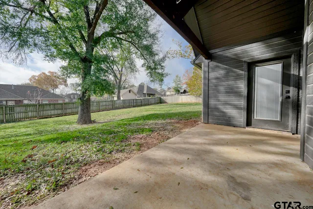 a view of a back yard of the house