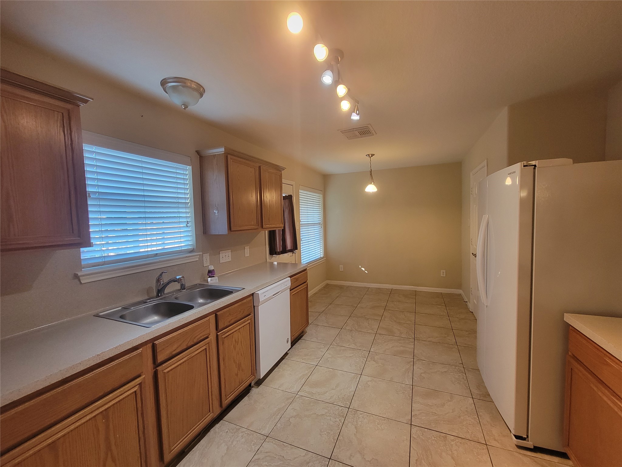 2414 Gwenfair Drive Spring, TX 77373 - Photo 11 of 35 Experience the inviting warmth of the kitchen with elegant wooden cabinets.