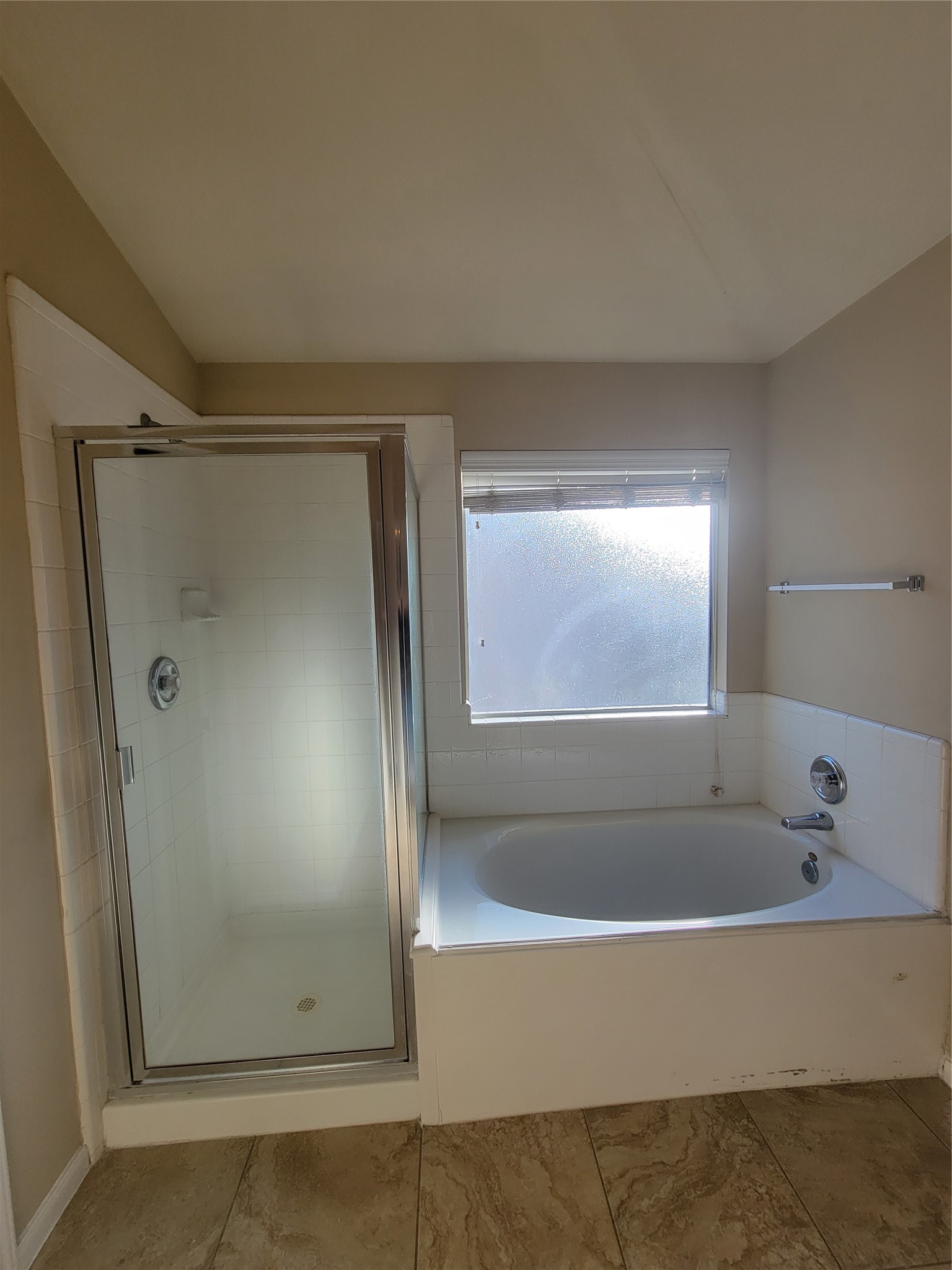 2414 Gwenfair Drive Spring, TX 77373 - Photo 21 of 35 Experience relaxation in this primary bathroom featuring both a stand-up shower and a bathtub.
