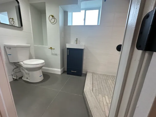a bathroom with a toilet and a sink