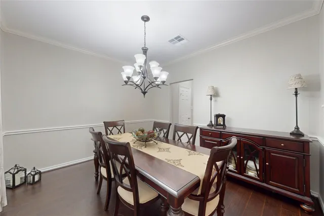 a sink with white cabinets