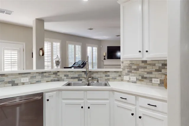 a kitchen with stainless steel appliances a sink stove and refrigerator