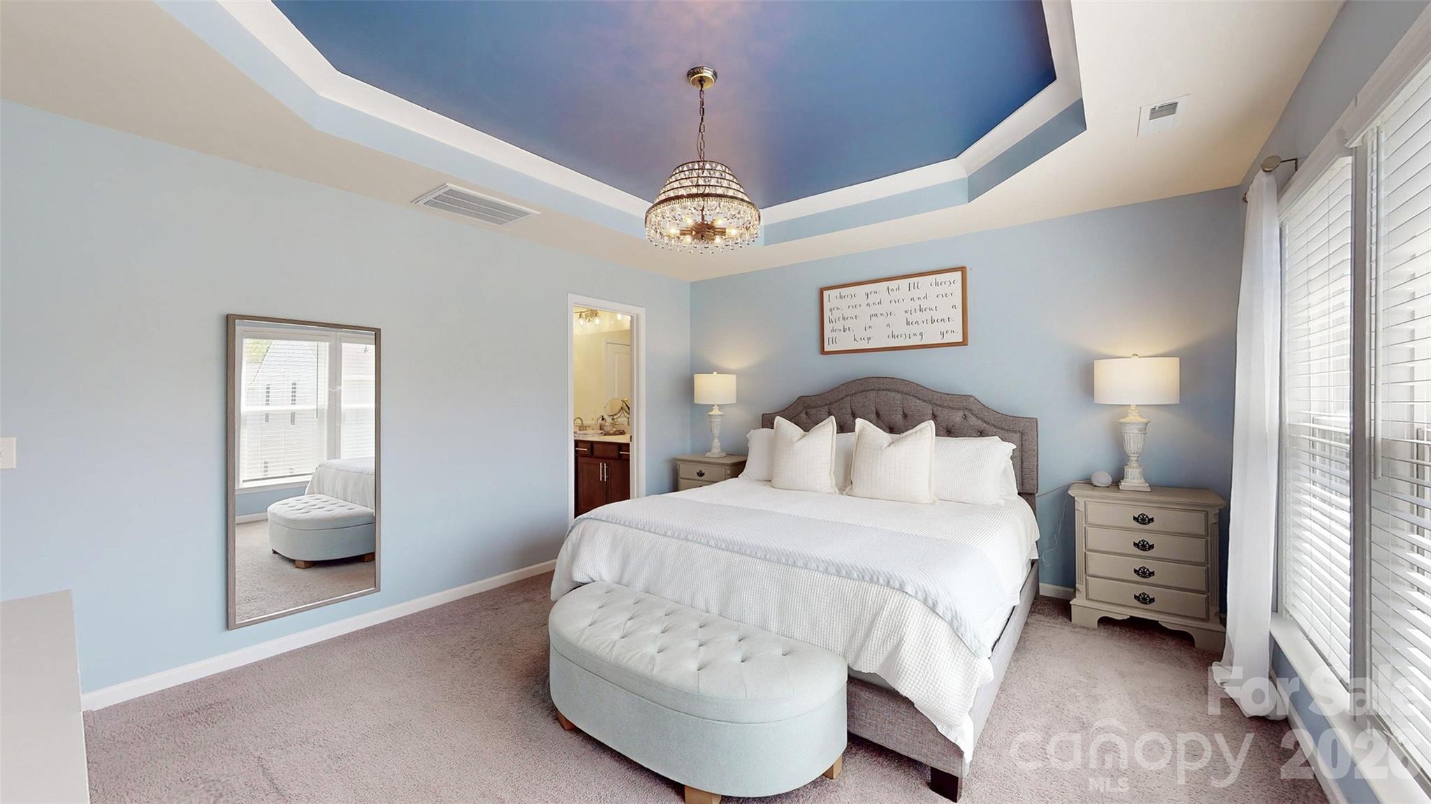 827 Canoe Song Road Fort Mill, SC 29708 - Photo 24 of 33 a bedroom with a bed and a walk in closet