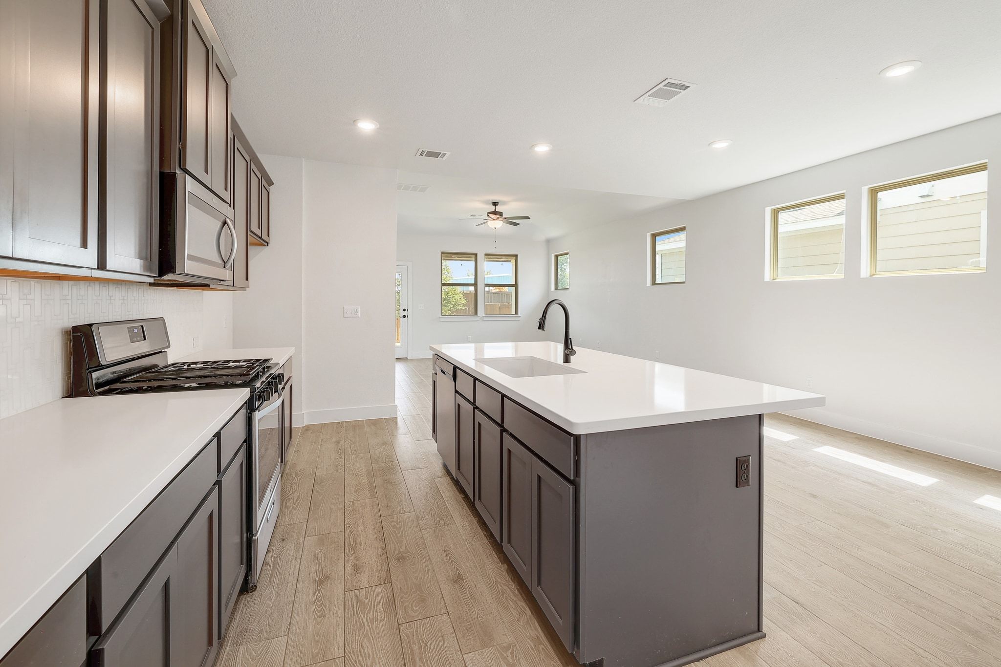 6111 Dunfries Lane Austin, TX 78744 - Photo 12 of 30 a kitchen with a sink and stove
