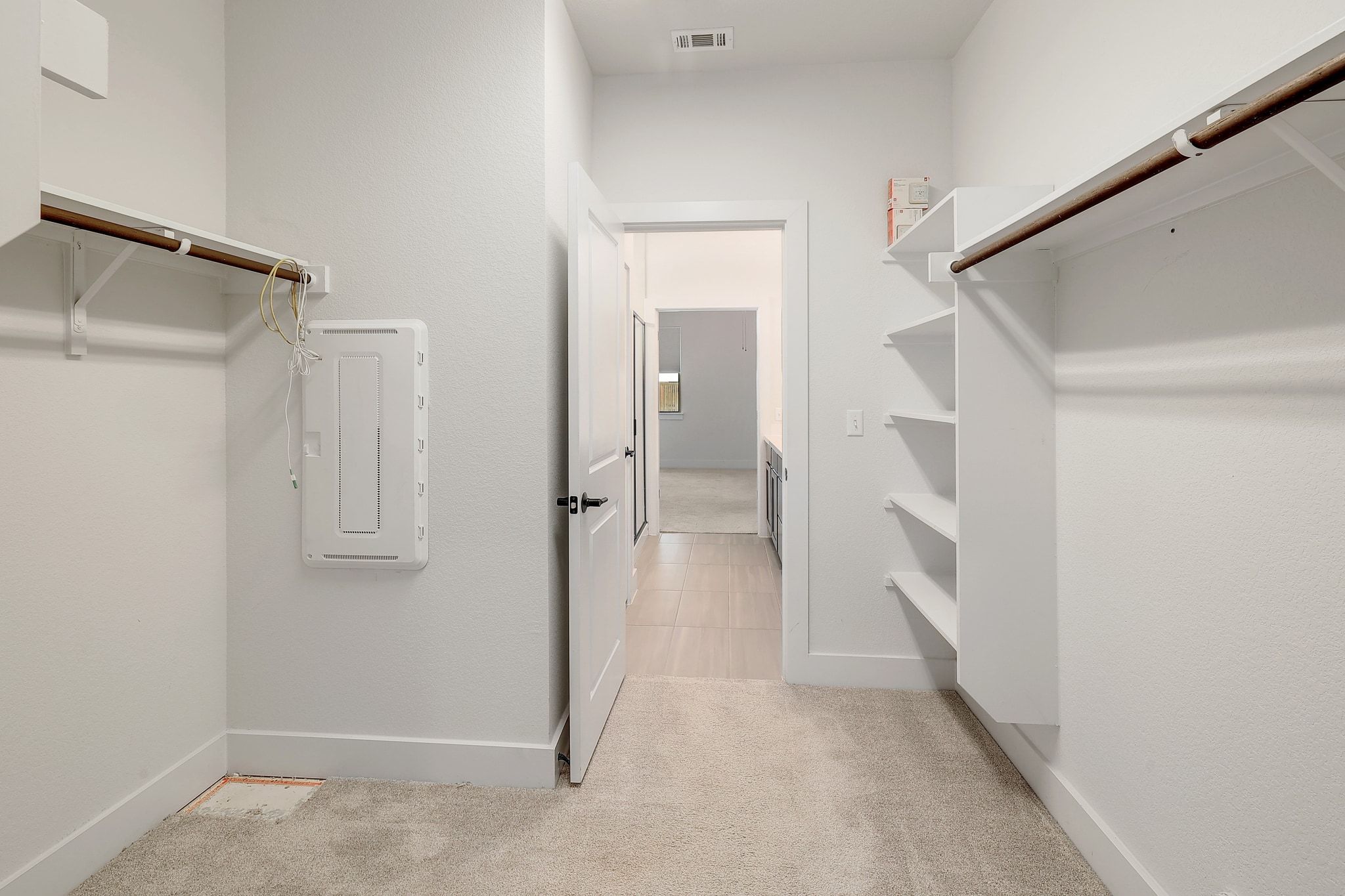 6111 Dunfries Lane Austin, TX 78744 - Photo 17 of 30 a view of a hallway with wooden floor and staircase