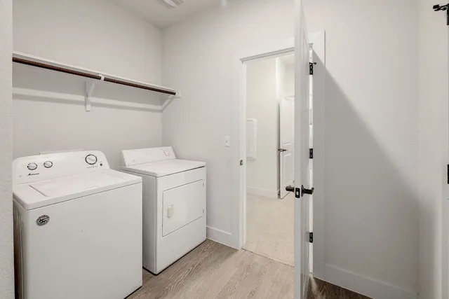 a view of bathroom with a washer and dryer