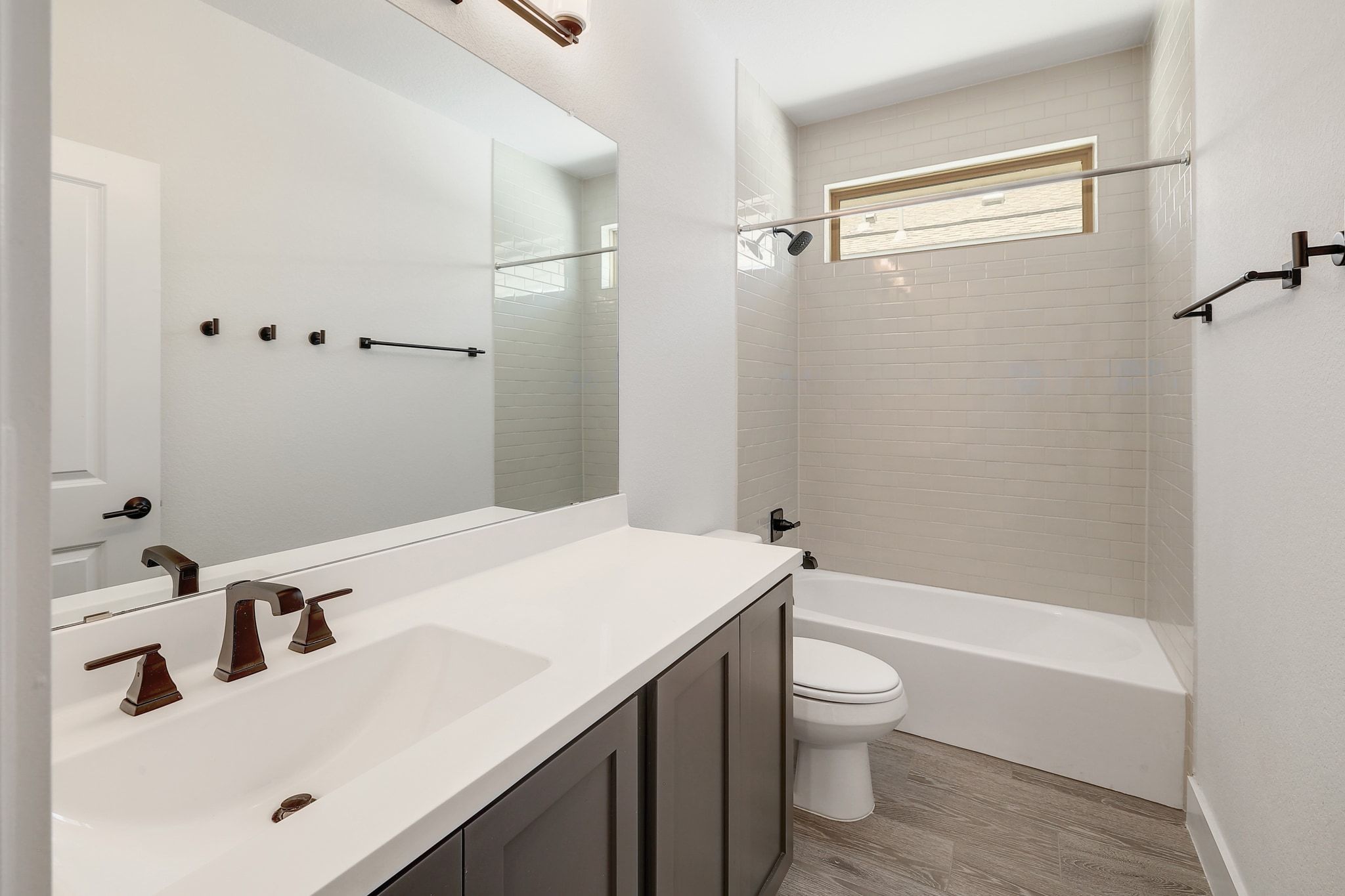 6111 Dunfries Lane Austin, TX 78744 - Photo 23 of 30 a bathroom with a sink a toilet and shower