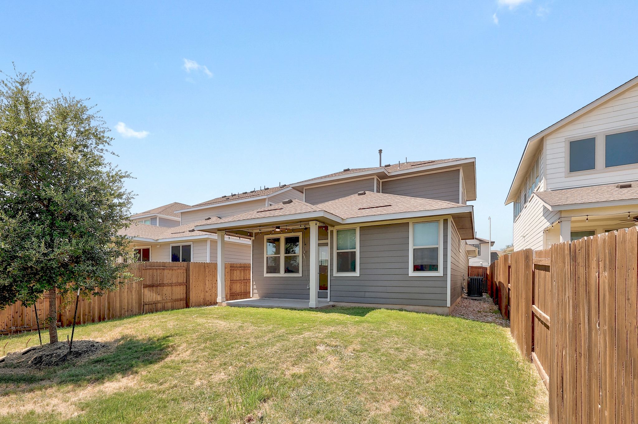 6111 Dunfries Lane Austin, TX 78744 - Photo 26 of 30 a view of a house with a backyard