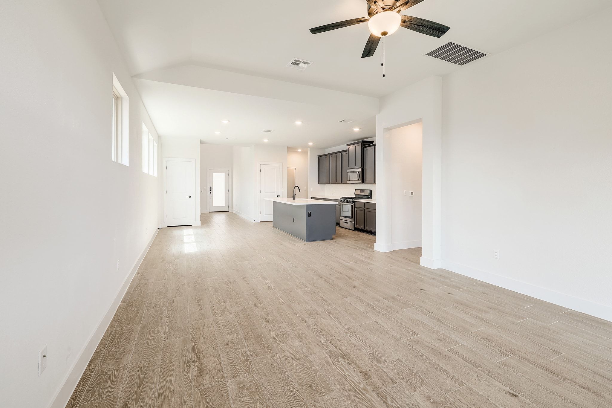 6111 Dunfries Lane Austin, TX 78744 - Photo 4 of 30 a view of a kitchen with a sink and cabinets