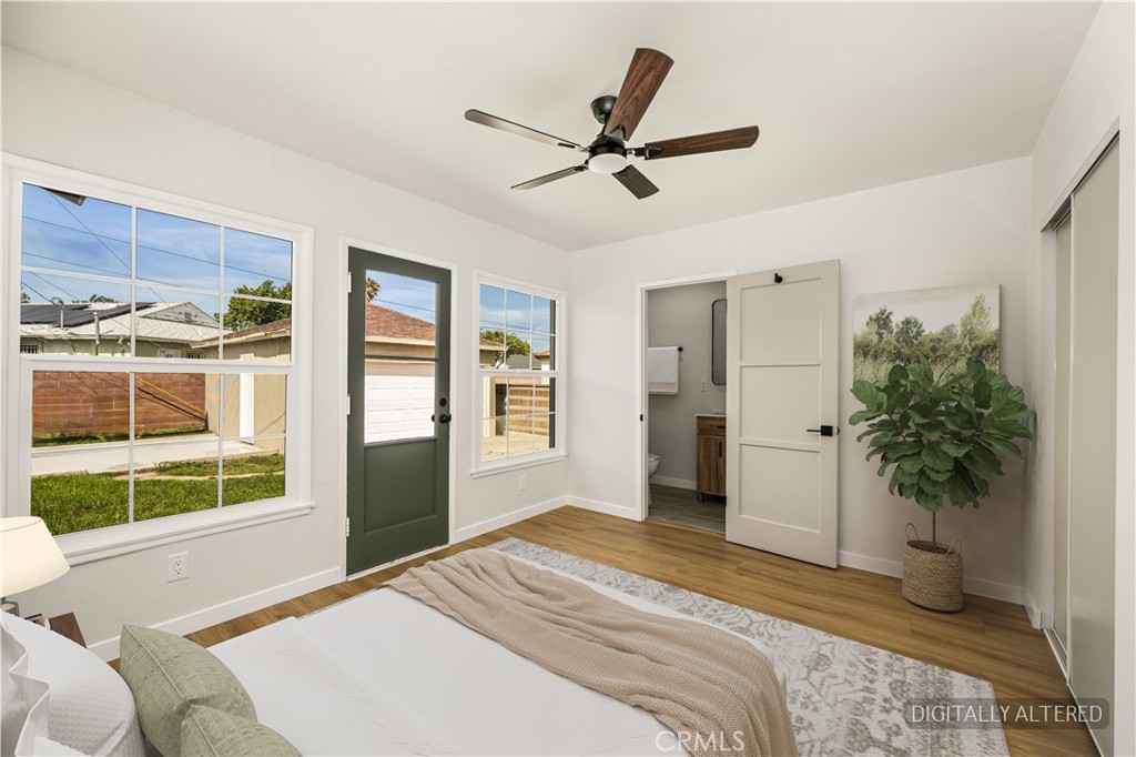 1013 West 138th Street Compton, CA 90222 - Photo 20 of 30 a bedroom with a bed and a large window