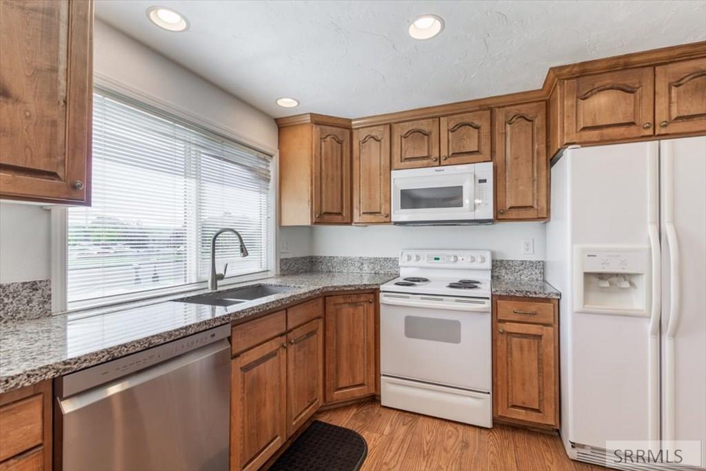 148 South 5th West Rexburg, ID 83440 - Photo 10 of 38 Granite Counters, Appliances included-Frig, Dishwasher, Microwave, Range/Oven
