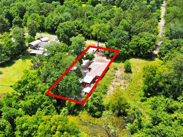 a view of a yard with swimming pool