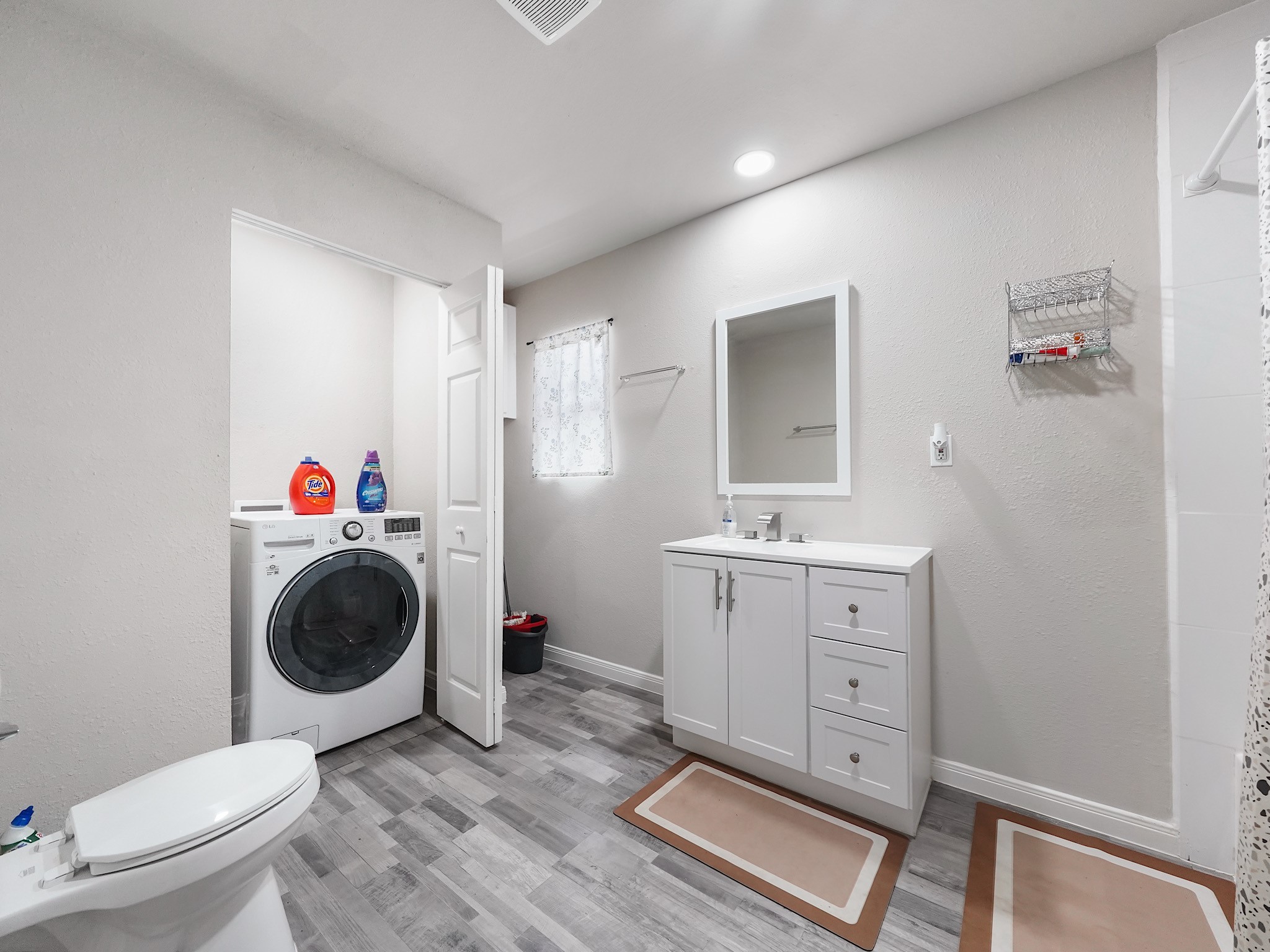 29 County Road 2131, Unit A Cleveland, TX 77327 - Photo 12 of 24 a bathroom with a toilet a sink and a shower