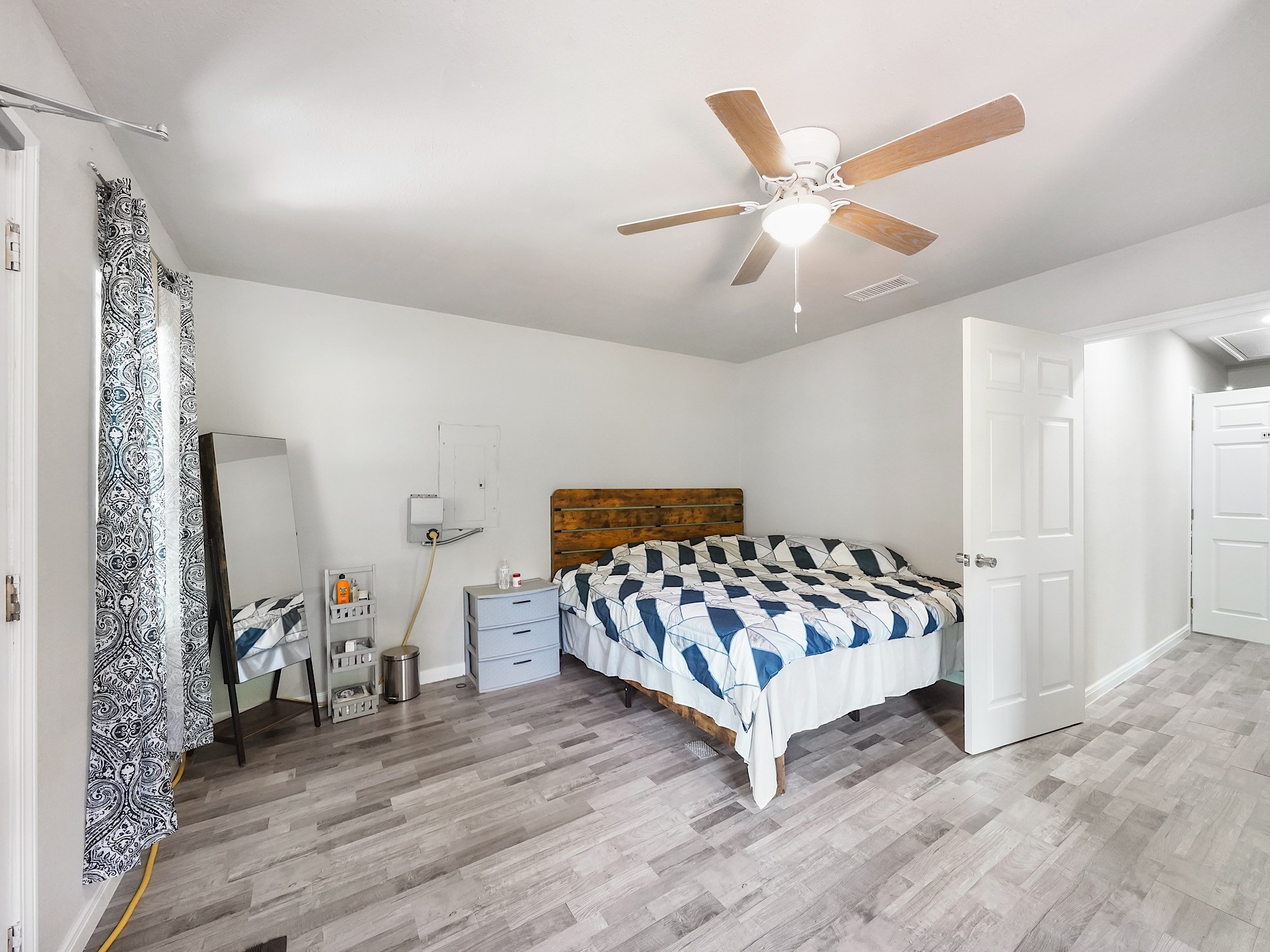 29 County Road 2131, Unit A Cleveland, TX 77327 - Photo 14 of 24 a bedroom with a bed and window