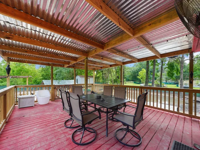 a view of yard with deck and trees