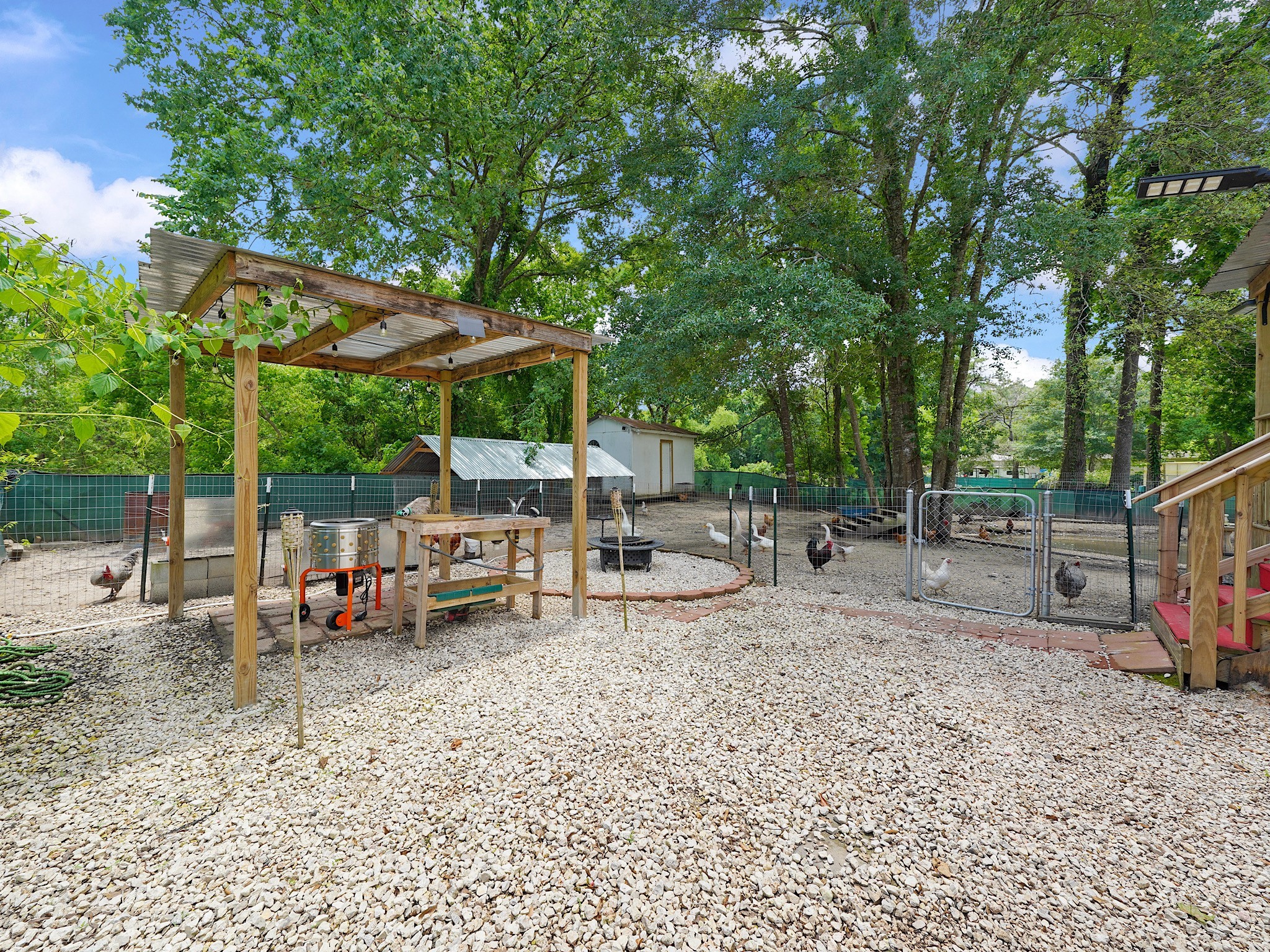 29 County Road 2131, Unit A Cleveland, TX 77327 - Photo 16 of 24 a view of yard with deck and trees
