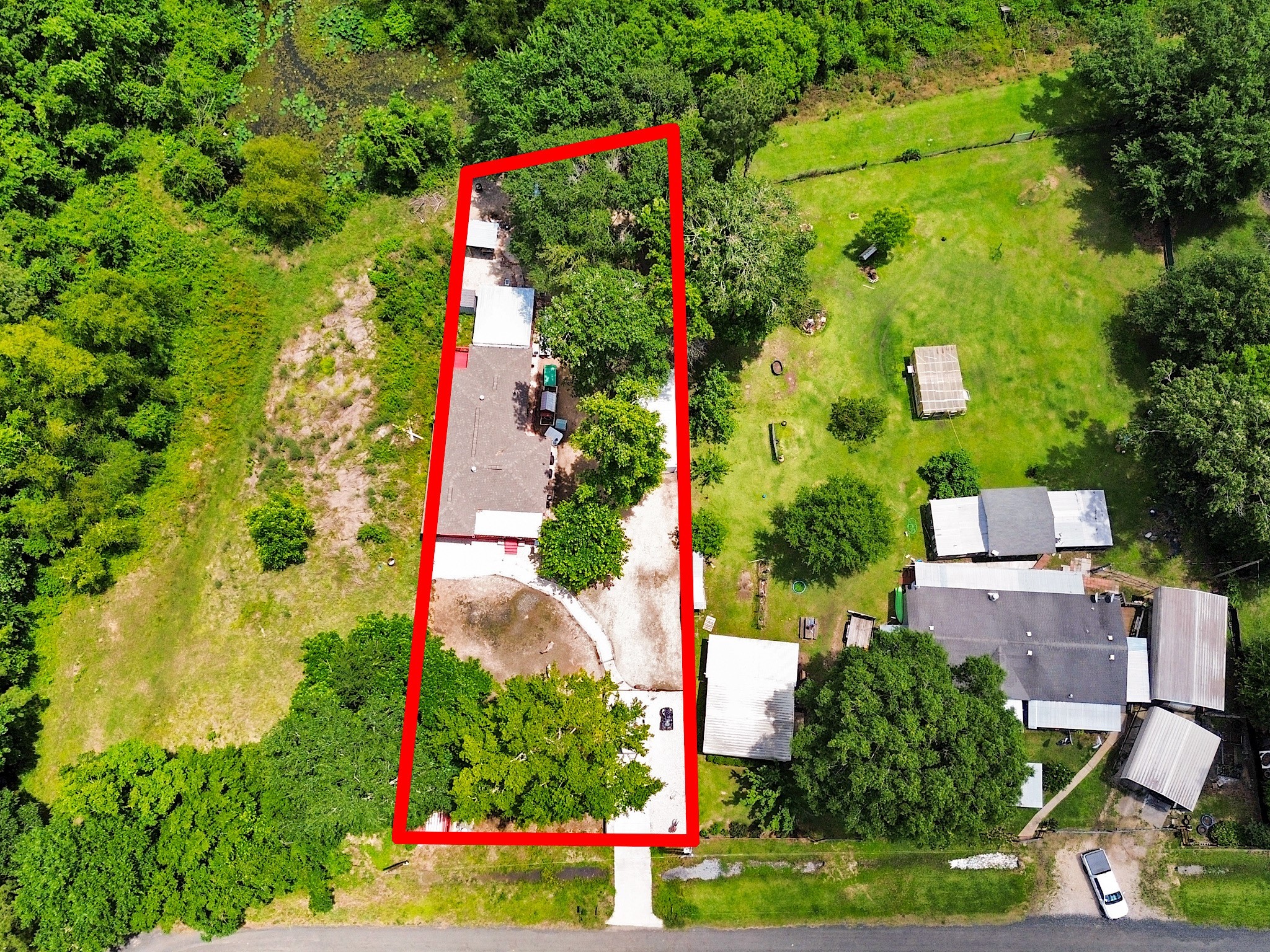 29 County Road 2131, Unit A Cleveland, TX 77327 - Photo 22 of 24 an aerial view of a houses with yard